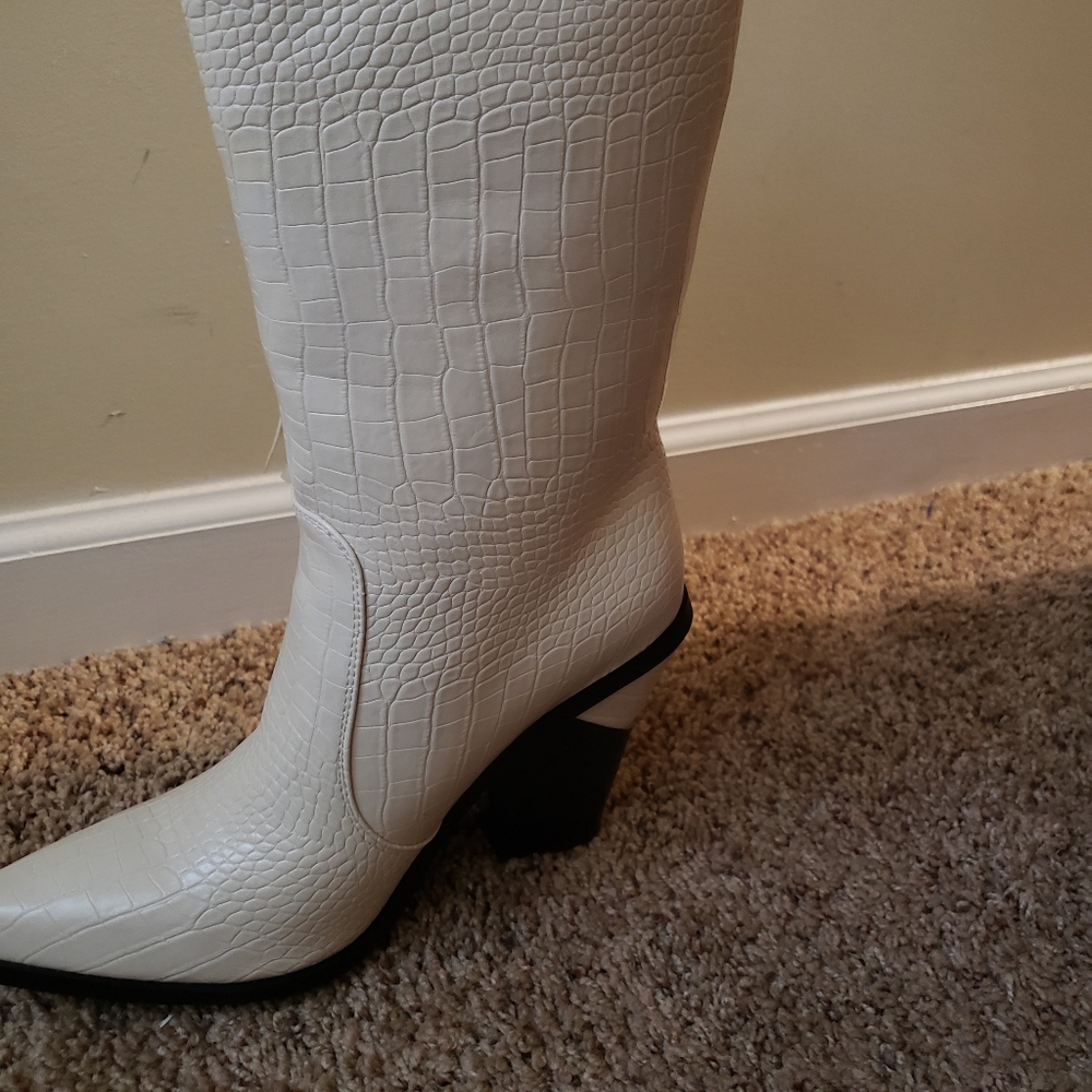 Faux winter white leather booties with fringe.